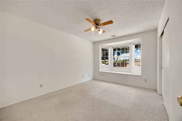 4159 Redline Dr, Lakewood, CA 90713 - spare room with light colored carpet, a ceiling fan, and a textured ceiling