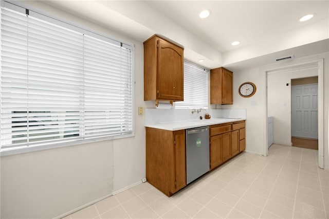 4159 Redline Dr, Lakewood, CA 90713 - kitchen featuring dishwasher, light countertops, brown cabinets, and recessed lighting
