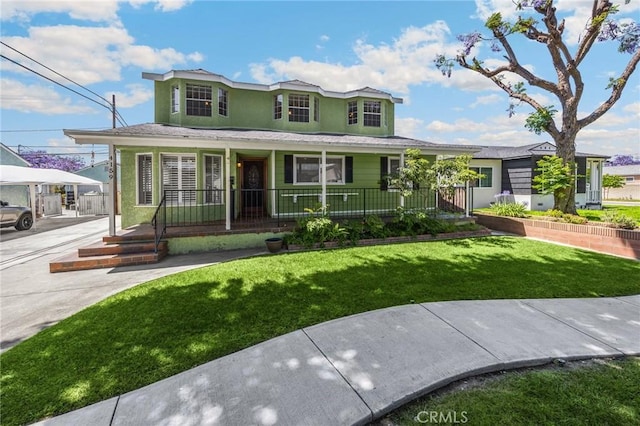 4159 Redline Dr, Lakewood, CA 90713 - view of front of home featuring covered porch, a front lawn, and stucco siding