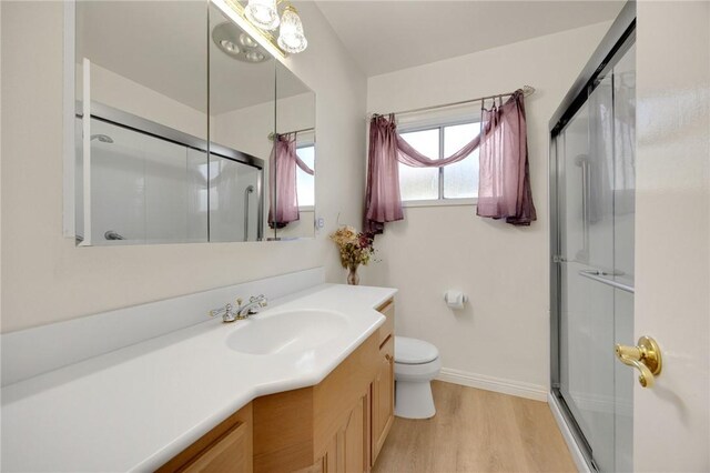 4159 Redline Dr, Lakewood, CA 90713 - full bathroom with vanity, a shower with door, and wood finished floors