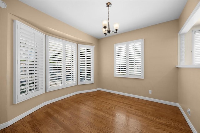 4159 Redline Dr, Lakewood, CA 90713 - unfurnished dining area featuring a chandelier and wood finished floors