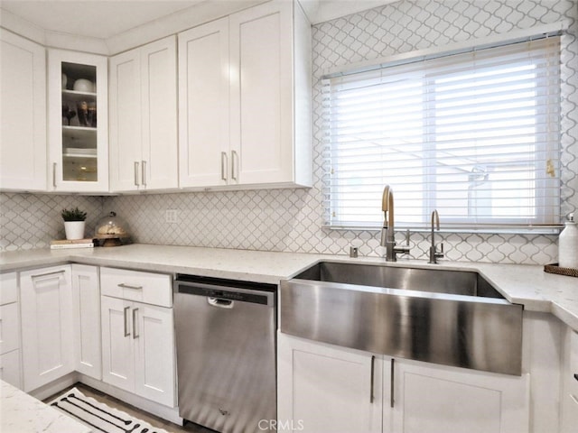 5435 W 76th St, Los Angeles, CA 90045 - kitchen featuring stainless steel dishwasher, white cabinetry, tasteful backsplash, and glass insert cabinets
