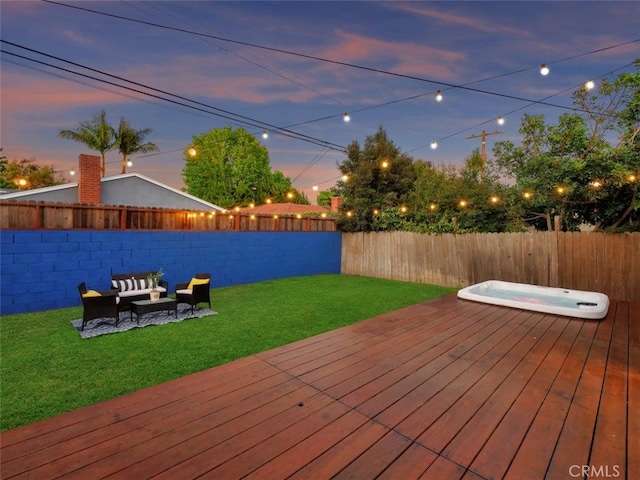 5435 W 76th St, Los Angeles, CA 90045 - deck at dusk featuring a fenced backyard, an outdoor hot tub, and an outdoor hangout area