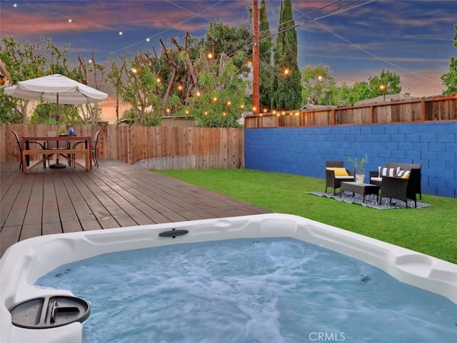5435 W 76th St, Los Angeles, CA 90045 - pool at dusk featuring a deck, a fenced backyard, and a hot tub