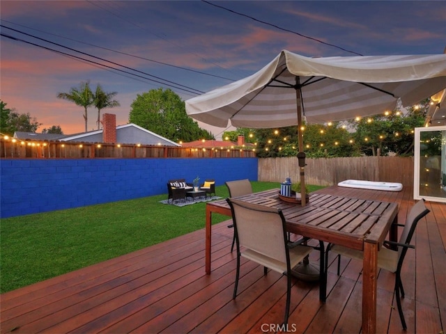 5435 W 76th St, Los Angeles, CA 90045 - deck at dusk with outdoor dining space and a fenced backyard