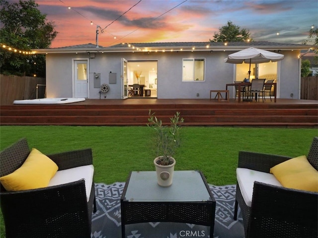 5435 W 76th St, Los Angeles, CA 90045 - back of property with stucco siding, a wooden deck, and an outdoor hangout area
