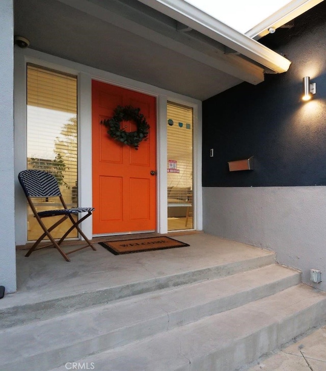 5435 W 76th St, Los Angeles, CA 90045 - property entrance with stucco siding and a surveillance system