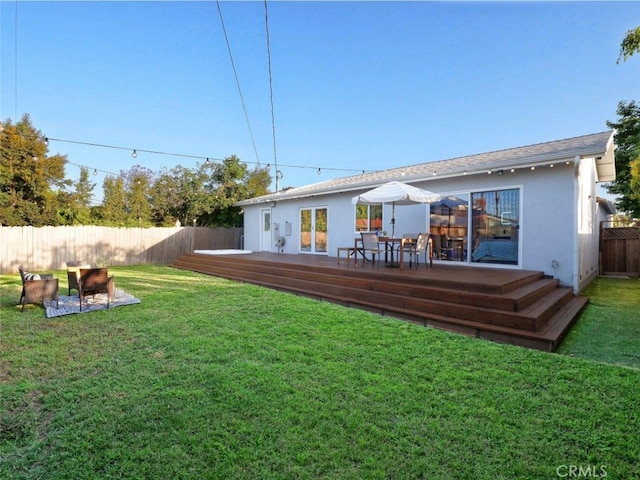 5435 W 76th St, Los Angeles, CA 90045 - rear view of property with a deck, a fenced backyard, stucco siding, and outdoor dining space