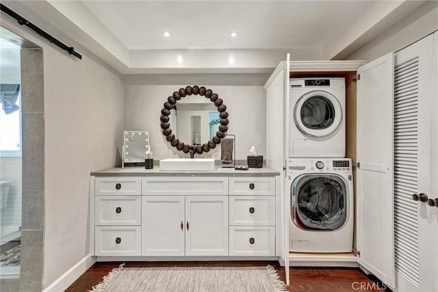 891 Palo Verde Ave, Long Beach, CA 90815 - washroom featuring stacked washer / drying machine, dark wood-style floors, and recessed lighting