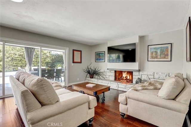 891 Palo Verde Ave, Long Beach, CA 90815 - living area featuring a fireplace and dark wood-style floors