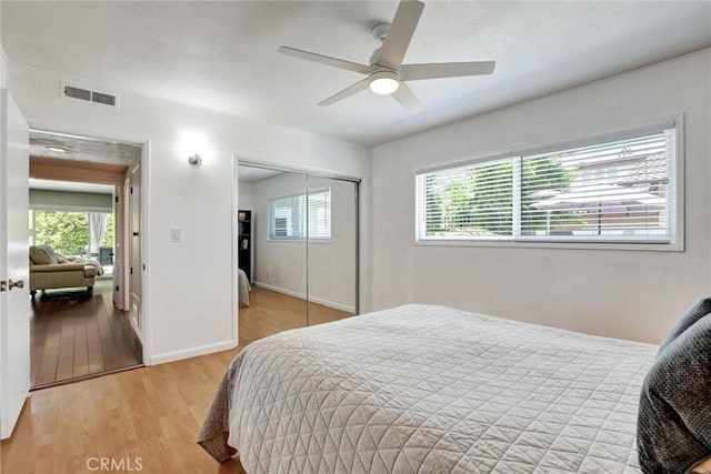 891 Palo Verde Ave, Long Beach, CA 90815 - bedroom with multiple windows, light wood-style flooring, a closet, and a ceiling fan
