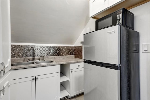 891 Palo Verde Ave, Long Beach, CA 90815 - kitchen featuring freestanding refrigerator, white cabinetry, lofted ceiling, open shelves, and light countertops