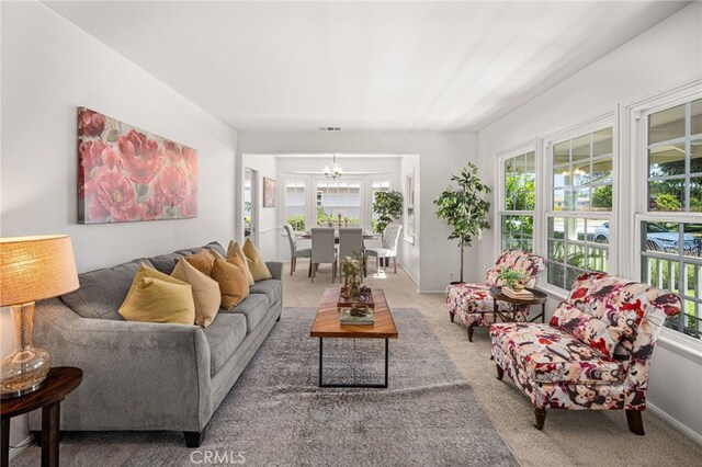 209 S Homerest Ave, West Covina, CA 91791 - carpeted living area featuring a chandelier