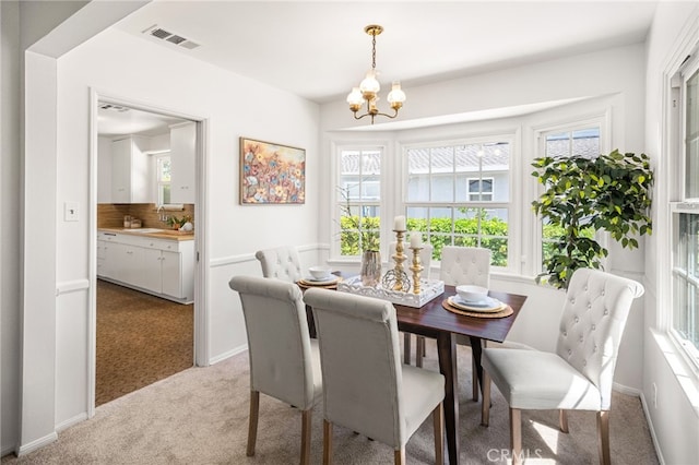 209 S Homerest Ave, West Covina, CA 91791 - dining area featuring carpet floors and a chandelier