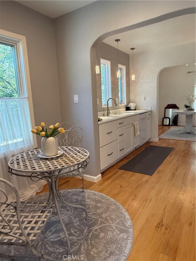 315 W 6th Ave, Chico, CA 95926 - dining area with arched walkways and light wood-style flooring