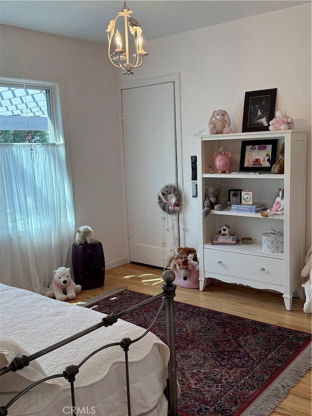 315 W 6th Ave, Chico, CA 95926 - bedroom featuring light wood finished floors and a chandelier