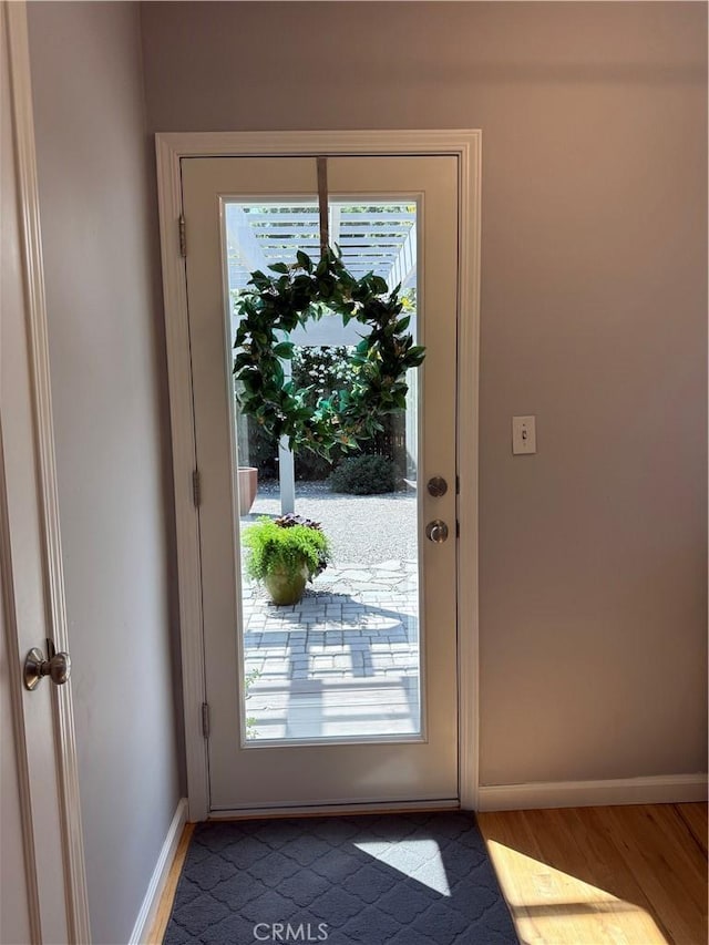 315 W 6th Ave, Chico, CA 95926 - doorway to outside featuring wood finished floors and baseboards