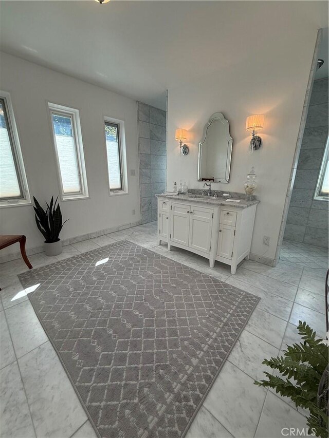 315 W 6th Ave, Chico, CA 95926 - bathroom featuring vanity, marble finish floors, and a tile shower