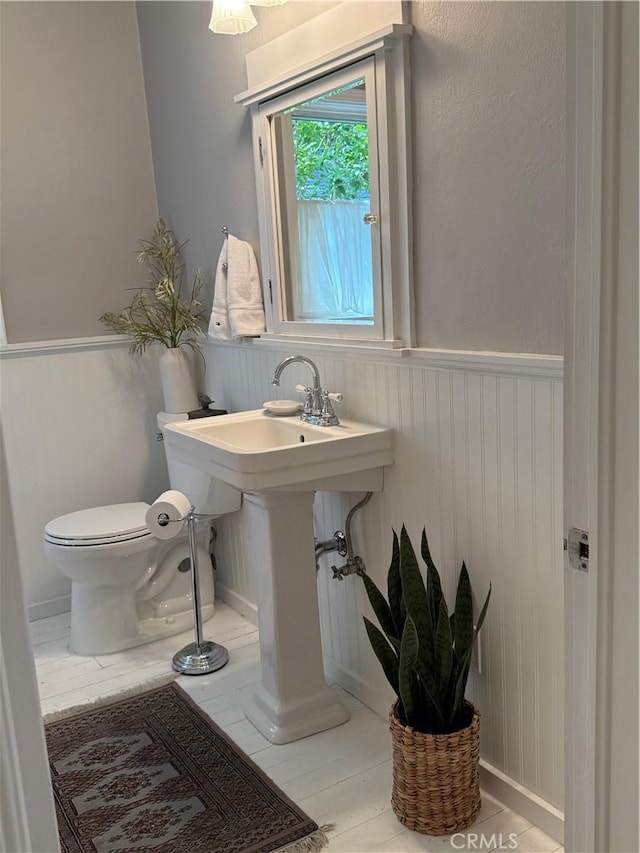 315 W 6th Ave, Chico, CA 95926 - bathroom featuring a wainscoted wall and toilet