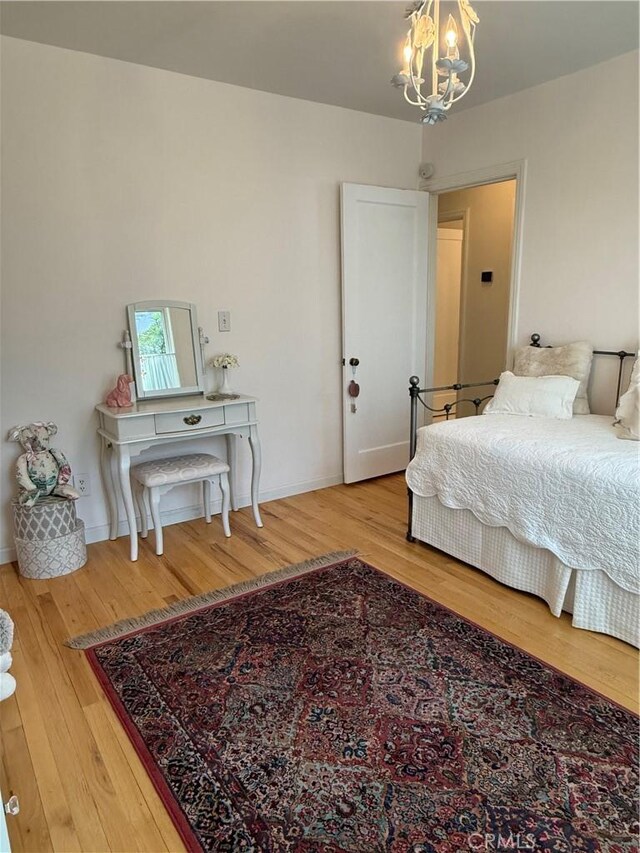 315 W 6th Ave, Chico, CA 95926 - bedroom featuring a chandelier and wood finished floors