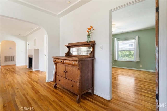 700 Hillcrest Dr, Bakersfield, CA 93305 - corridor with arched walkways and wood finished floors