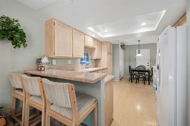 13562 Mahogany Pl, Tustin, CA 92782 - kitchen featuring freestanding refrigerator, light brown cabinetry, light countertops, recessed lighting, and light wood-type flooring