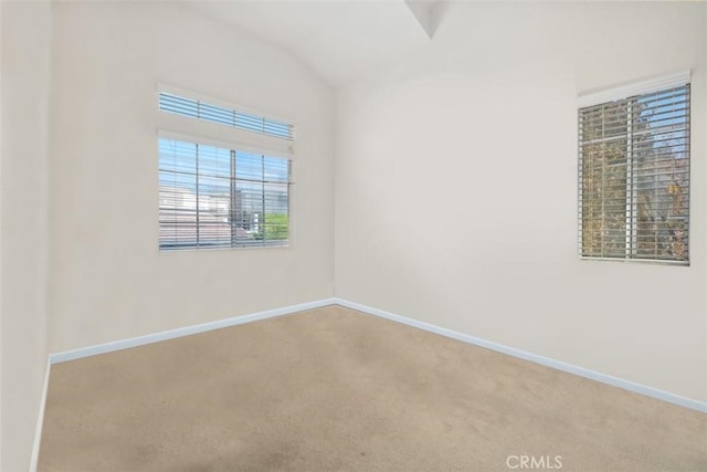 13562 Mahogany Pl, Tustin, CA 92782 - carpeted spare room with baseboards and vaulted ceiling