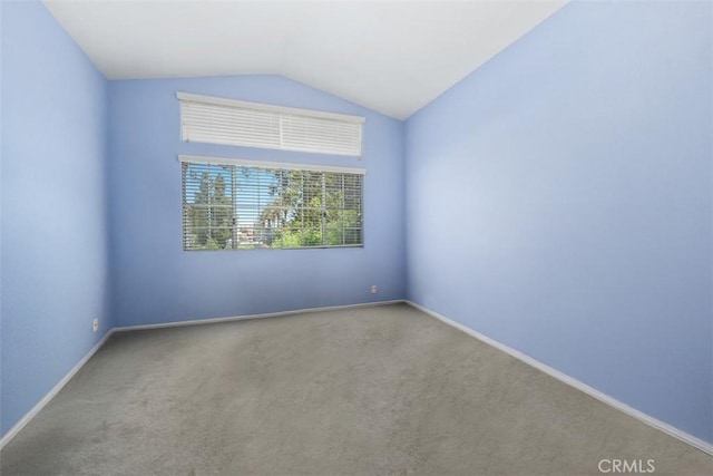 13562 Mahogany Pl, Tustin, CA 92782 - carpeted spare room featuring lofted ceiling and baseboards