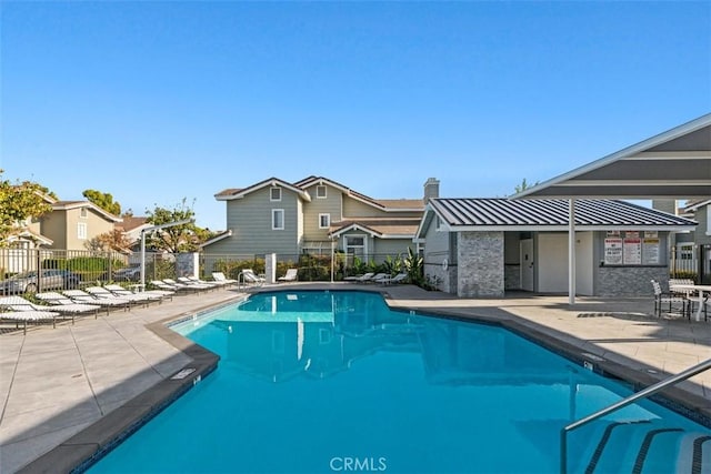13562 Mahogany Pl, Tustin, CA 92782 - community pool with a patio area