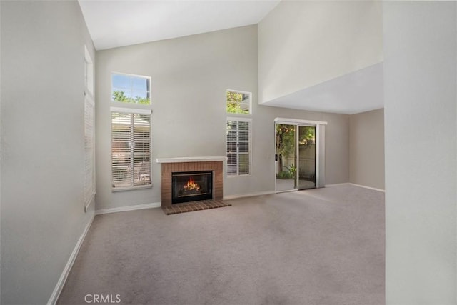 13562 Mahogany Pl, Tustin, CA 92782 - unfurnished living room with high vaulted ceiling, a brick fireplace, and carpet