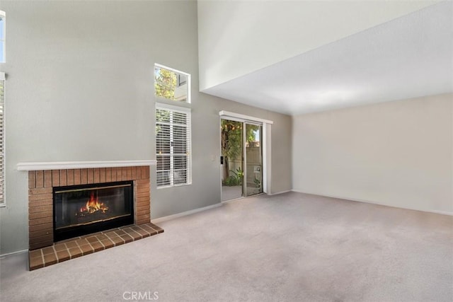 13562 Mahogany Pl, Tustin, CA 92782 - unfurnished living room with carpet flooring, a brick fireplace, and a high ceiling