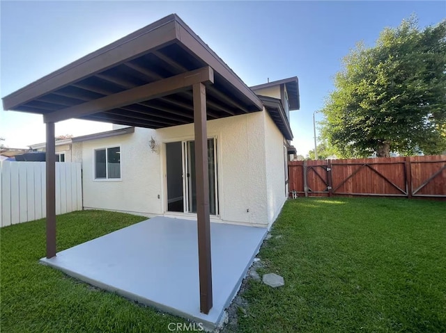 4539 Brookview Ct, Chino Hills, CA 91709 - rear view of house featuring a patio, stucco siding, and a gate