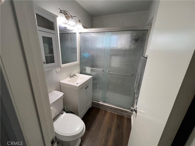 246 E 27th St, San Bernardino, CA 92404 - bathroom featuring vanity, wood finished floors, and a shower stall
