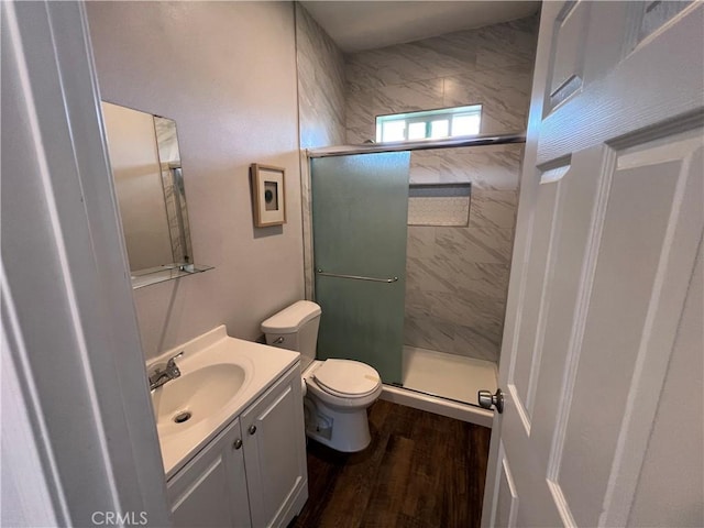 246 E 27th St, San Bernardino, CA 92404 - full bath with a stall shower, vanity, and wood finished floors