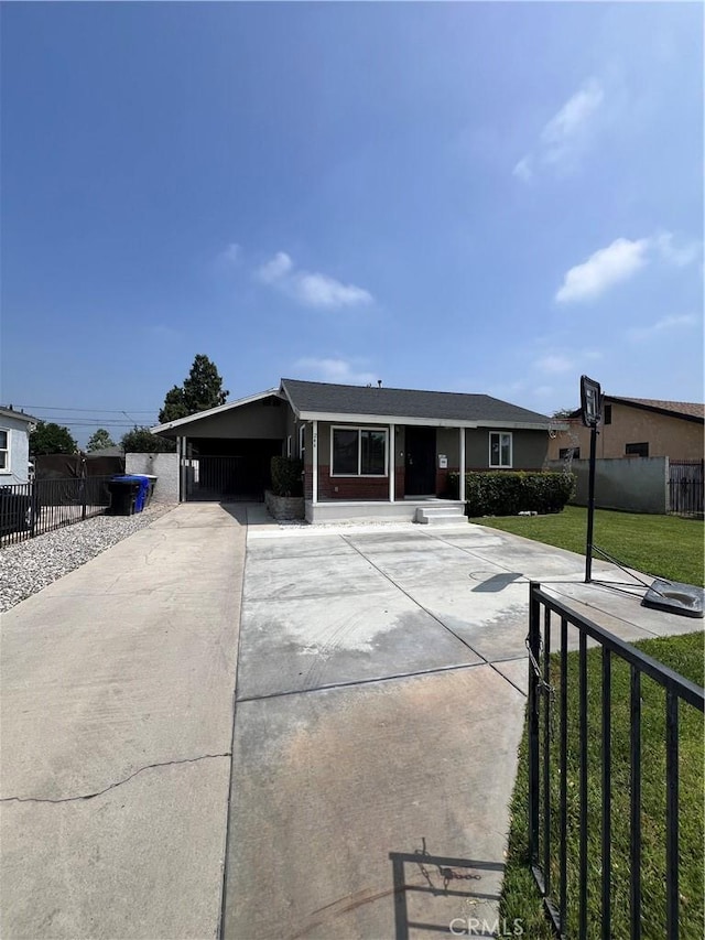 246 E 27th St, San Bernardino, CA 92404 - ranch-style house featuring concrete driveway and an attached carport