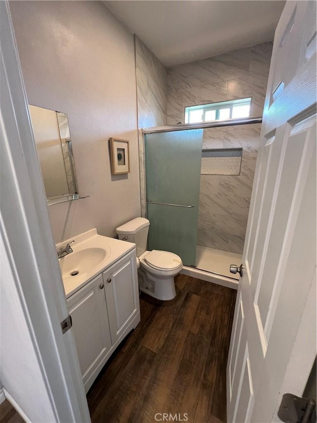 246 E 27th St, San Bernardino, CA 92404 - full bath featuring vanity, a stall shower, and wood finished floors