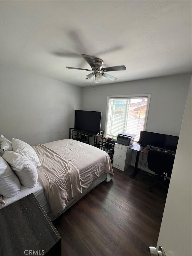 246 E 27th St, San Bernardino, CA 92404 - bedroom with dark wood-style floors, an office area, and a ceiling fan