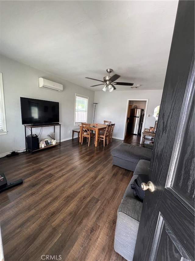 246 E 27th St, San Bernardino, CA 92404 - living room with a wall mounted air conditioner, wood finished floors, and a ceiling fan