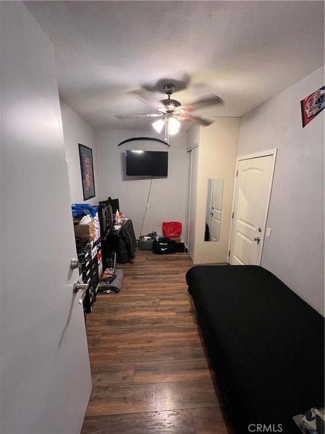 246 E 27th St, San Bernardino, CA 92404 - living area featuring ceiling fan, wood-type flooring, and a textured ceiling
