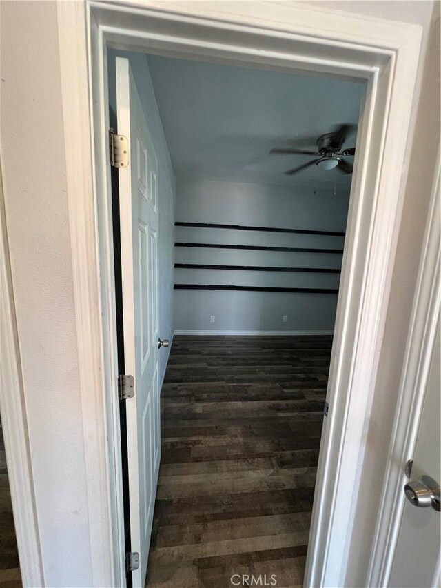 246 E 27th St, San Bernardino, CA 92404 - spacious closet with dark wood-style flooring and a ceiling fan