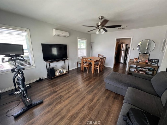 246 E 27th St, San Bernardino, CA 92404 - living room featuring a wall unit AC, dark wood finished floors, and ceiling fan