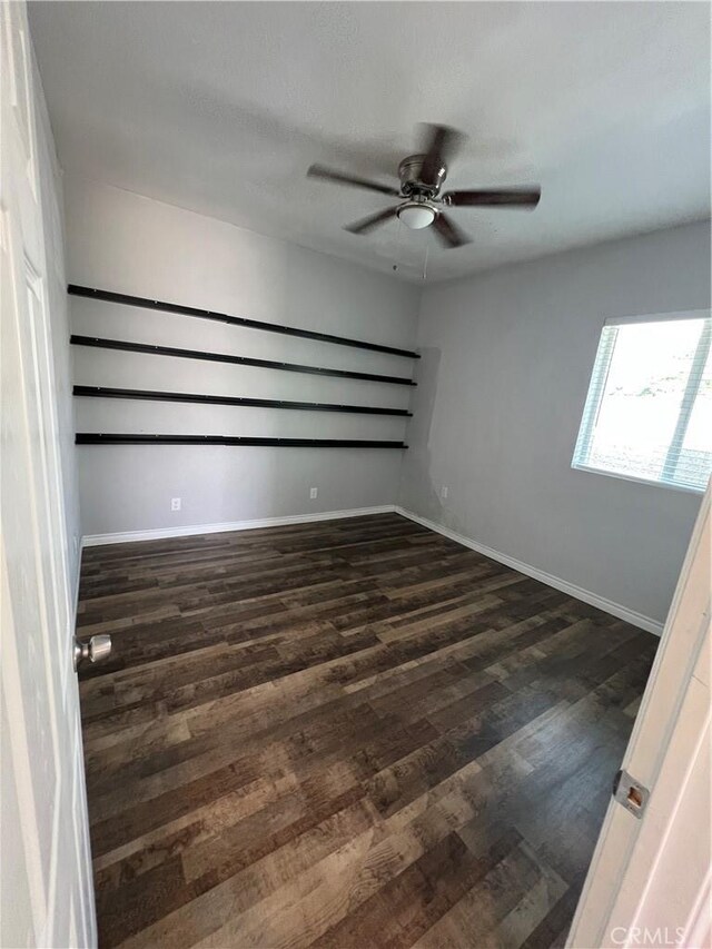 246 E 27th St, San Bernardino, CA 92404 - spare room with dark wood-type flooring and a ceiling fan