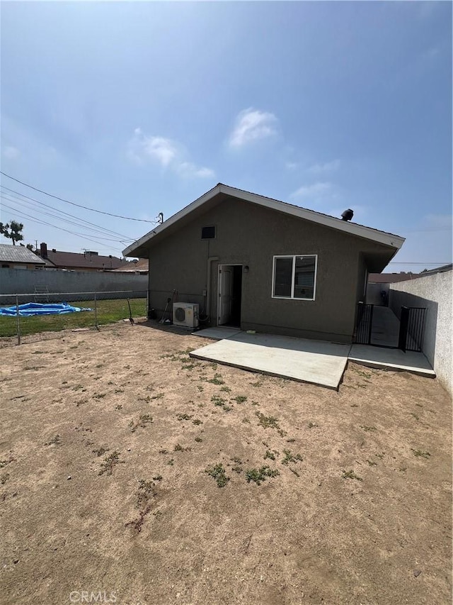 246 E 27th St, San Bernardino, CA 92404 - back of house with stucco siding and a patio area