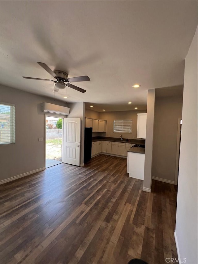246 E 27th St, San Bernardino, CA 92404 - kitchen featuring dark countertops, white cabinetry, ceiling fan, dark wood-type flooring, and recessed lighting