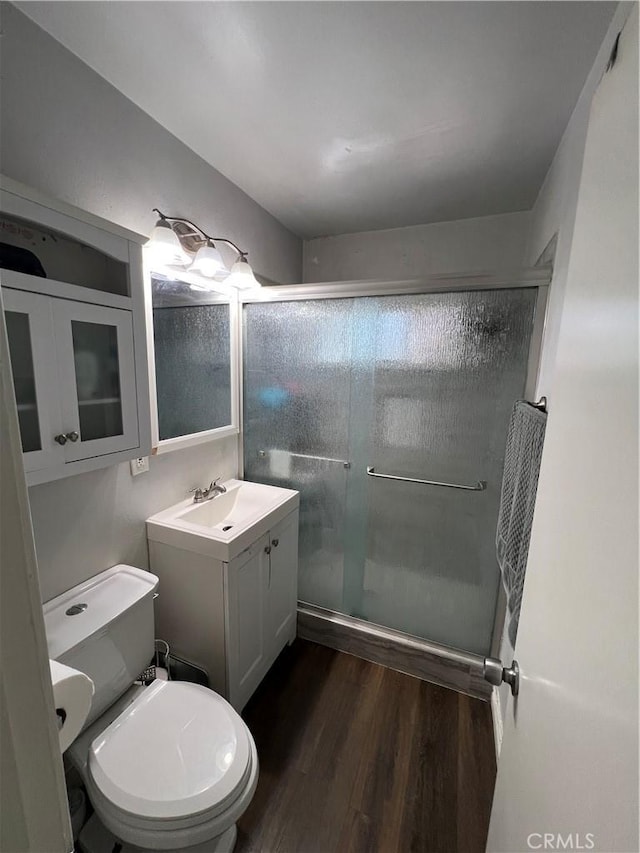 246 E 27th St, San Bernardino, CA 92404 - full bathroom with vanity, a shower stall, and wood finished floors