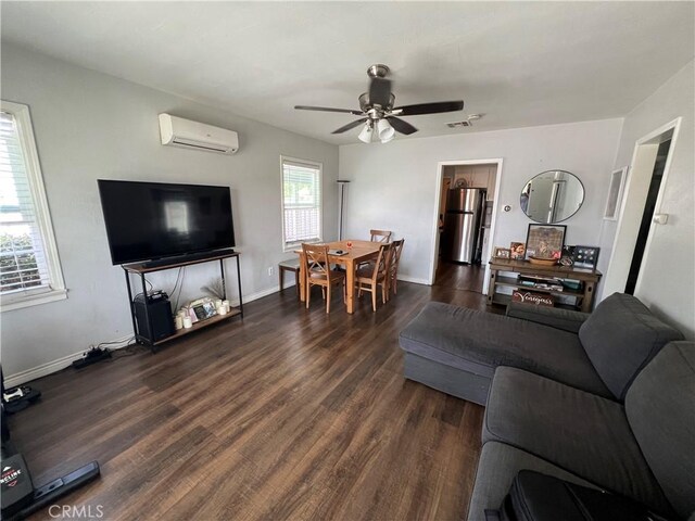 246 E 27th St, San Bernardino, CA 92404 - living room with a wall mounted AC, dark wood-style flooring, and ceiling fan