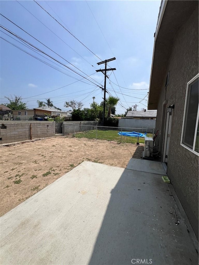 246 E 27th St, San Bernardino, CA 92404 - fenced backyard featuring a patio area