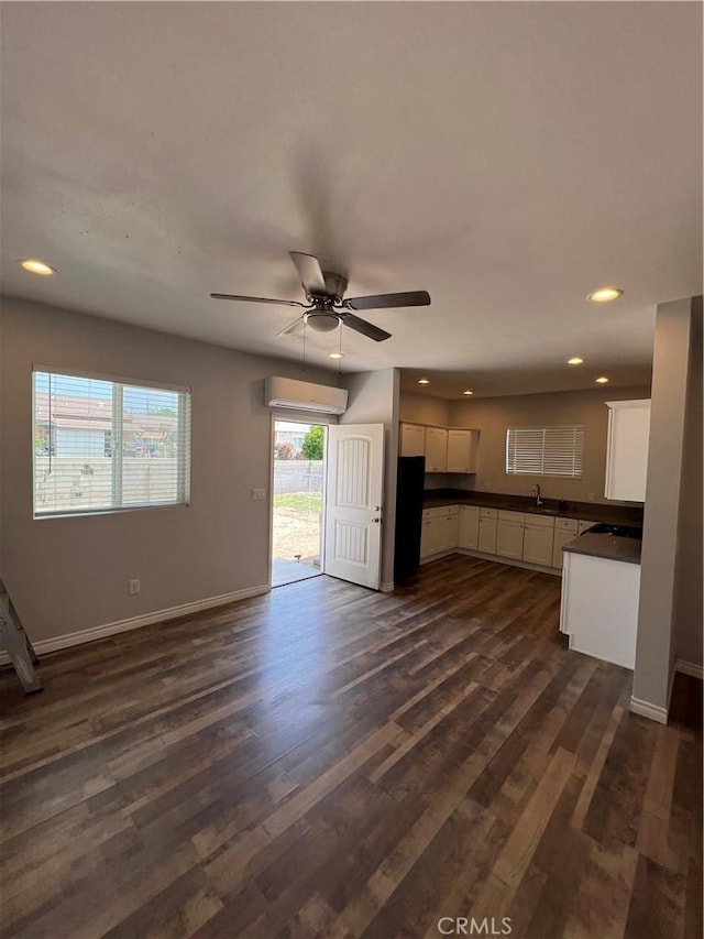 246 E 27th St, San Bernardino, CA 92404 - kitchen featuring dark countertops, white cabinets, a ceiling fan, dark wood-style flooring, and recessed lighting