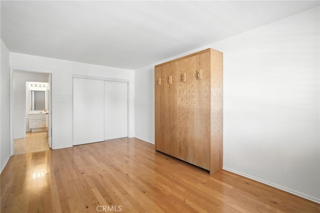 39312 Via Belleza, Murrieta, CA 92563 - unfurnished bedroom featuring light wood-style flooring and a closet