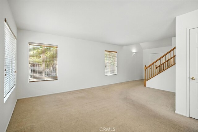 39312 Via Belleza, Murrieta, CA 92563 - unfurnished living room with carpet and plenty of natural light